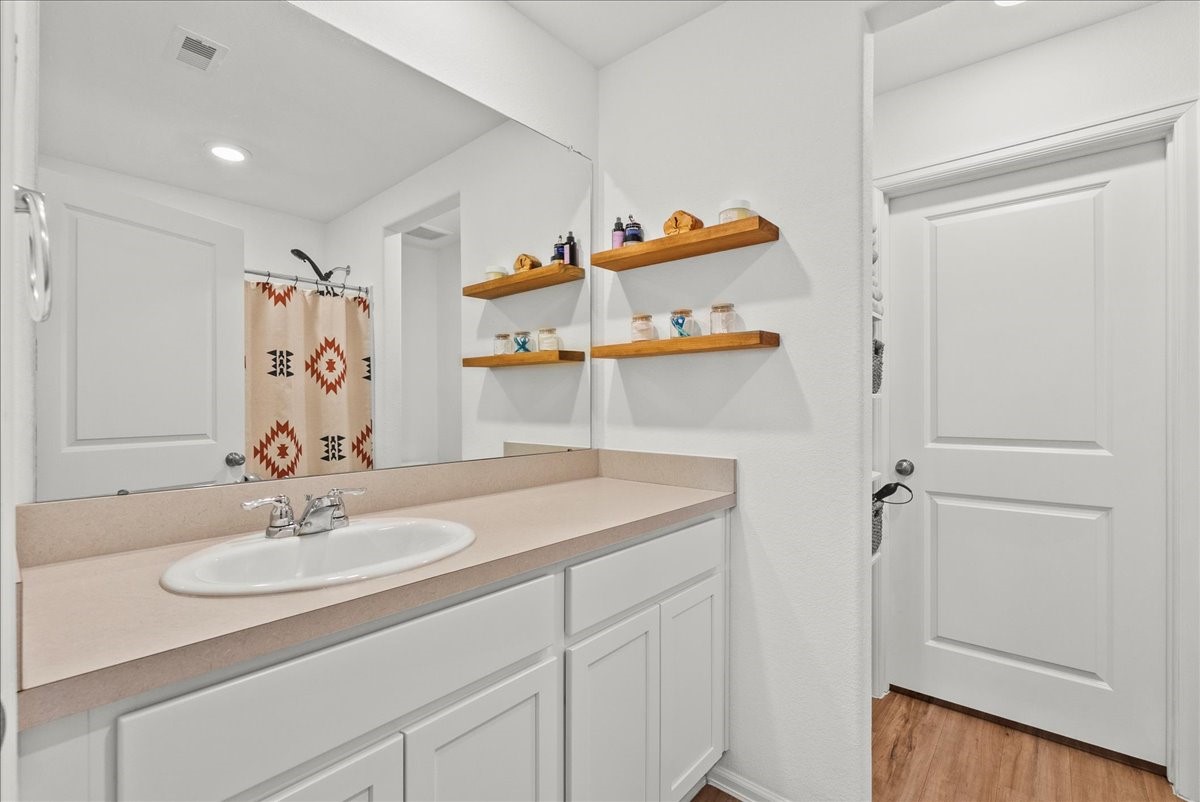 14410 Boyton Holw Trace Rosharon, TX 77583 - Photo 21 of 35 Primary En Suite Bathroom also has Luxe LVP flooring running through to the walk in closet.