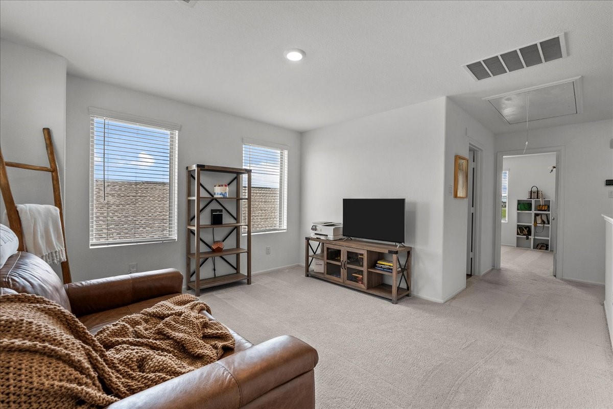 14410 Boyton Holw Trace Rosharon, TX 77583 - Photo 23 of 35 Currently used as a 2nd living area - could be used as a Home Office, Game Room or Home Gym. Notice the natural sunlight beaming into the second level of this home! don't worry this is an Energy Efficient build.