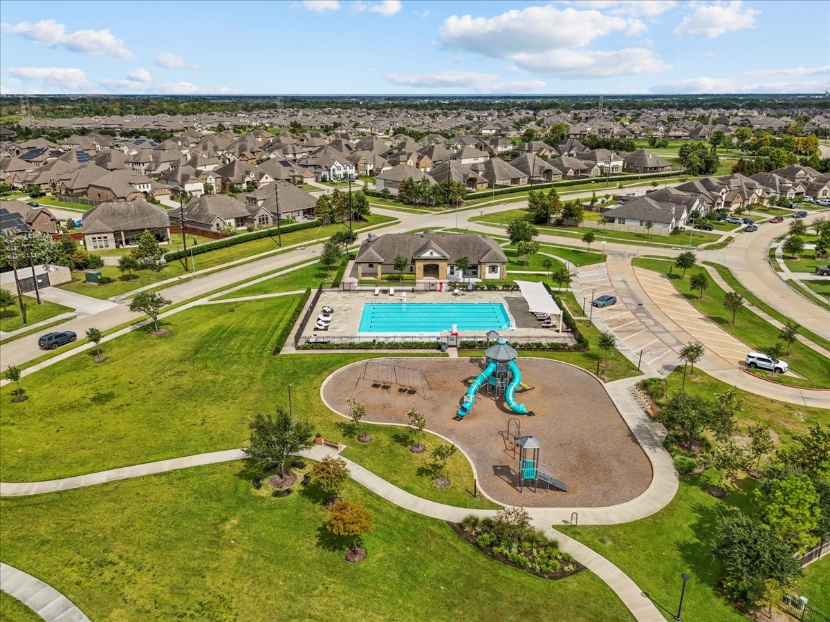 14410 Boyton Holw Trace Rosharon, TX 77583 - Photo 34 of 35 Lakes of Savannah has many walking trails that connect with other sections of the community. You’ll find Pocket Parks, Playgrounds, Launch Dock and as pictured here a Clubhouse, Pool and Playground.