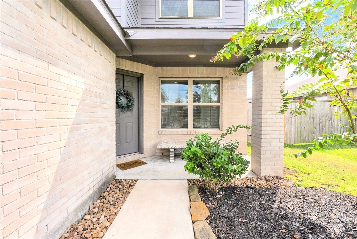 14410 Boyton Holw Trace Rosharon, TX 77583 - Photo 6 of 35 Cozy & Welcoming covered front porch - entry door is tucked away from the street for maximum privacy.