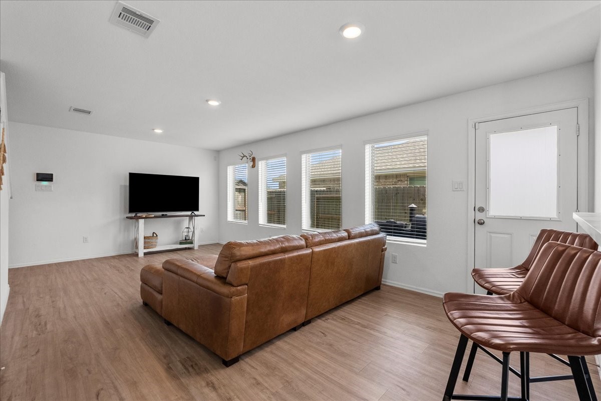 14410 Boyton Holw Trace Rosharon, TX 77583 - Photo 8 of 35 Other modern features include Recessed lighting, neutral tones and a side access door leads to the impressive backyard.