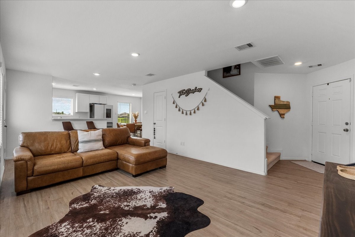14410 Boyton Holw Trace Rosharon, TX 77583 - Photo 10 of 35 View towards entry highlights the privacy given to interior of the ground floor. The Half bath is located under the staircase.
