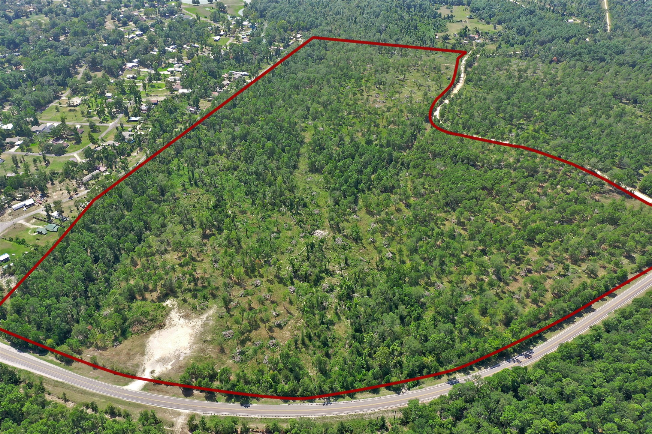 16-2 North Hanson Road Onalaska, TX 77360 - Photo 42 of 44 a view of a yard with a plant