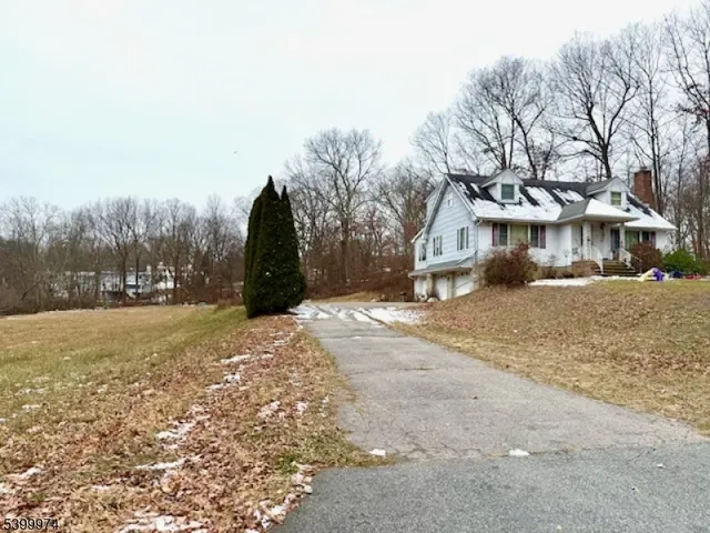 a view of large house with a yard