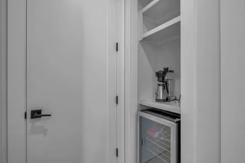 a view of a livingroom from a hallway