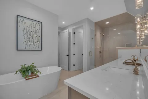 a bathroom with a bathtub and a sink