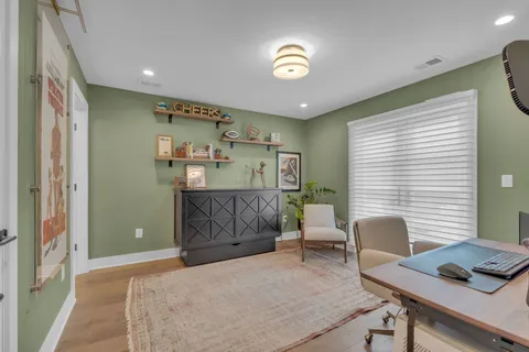 a workspace with furniture and window