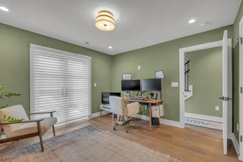 a workspace with furniture and a window