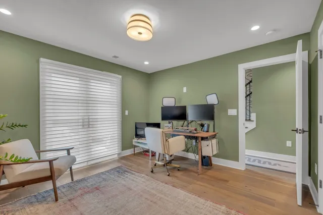 a workspace with furniture and a window