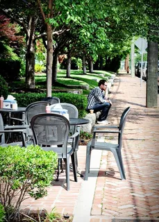a view of a swimming pool and sitting area