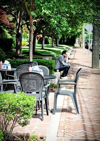 a view of a swimming pool and sitting area