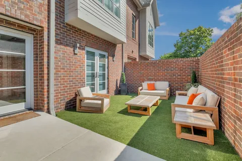 a backyard of a house with seating space