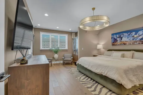 a bedroom with bed and a window