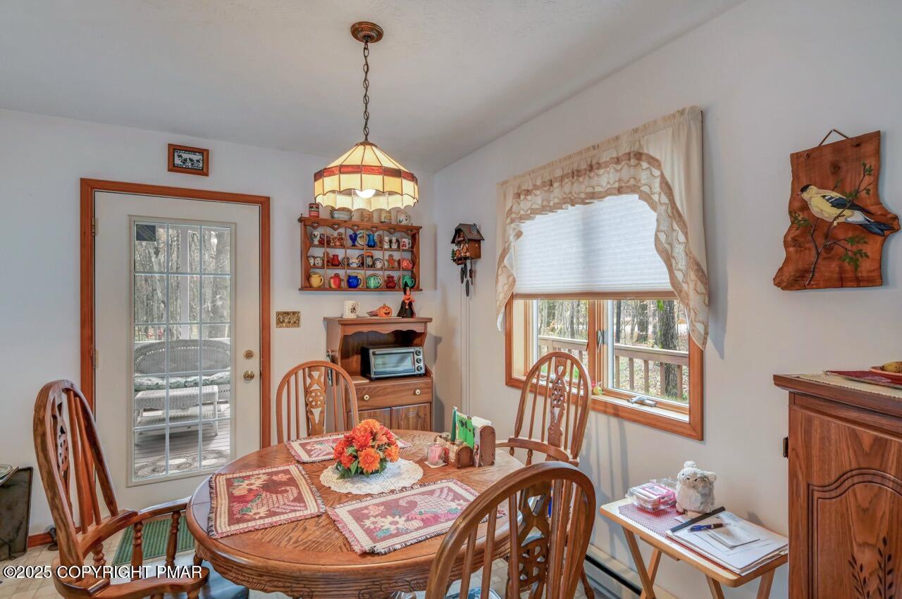 183 Panther Run Road Jim Thorpe, PA 18229 - Photo 15 of 59 a dining room with furniture a rug and a chandelier