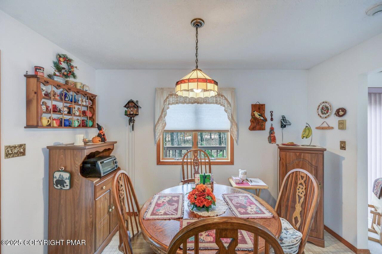 183 Panther Run Road Jim Thorpe, PA 18229 - Photo 18 of 59 a view of a dining room with furniture wooden floor and a chandelier
