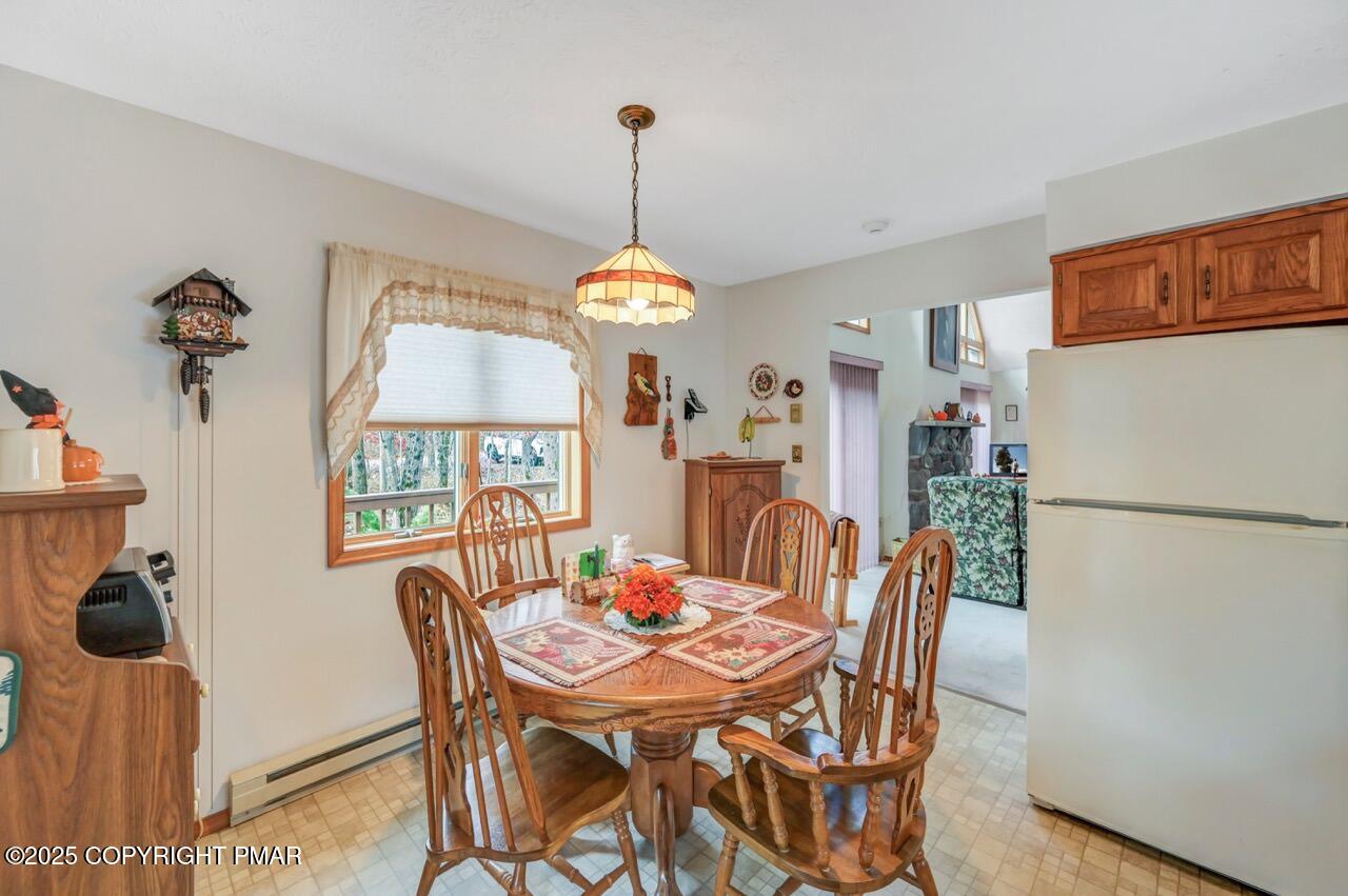 183 Panther Run Road Jim Thorpe, PA 18229 - Photo 19 of 59 a dining room with furniture a chandelier and wooden floor