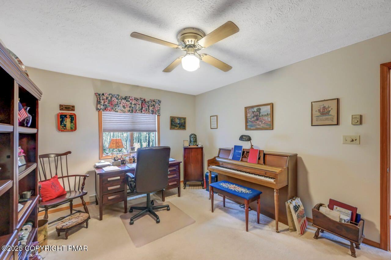 183 Panther Run Road Jim Thorpe, PA 18229 - Photo 27 of 59 a room with furniture and a bookshelf