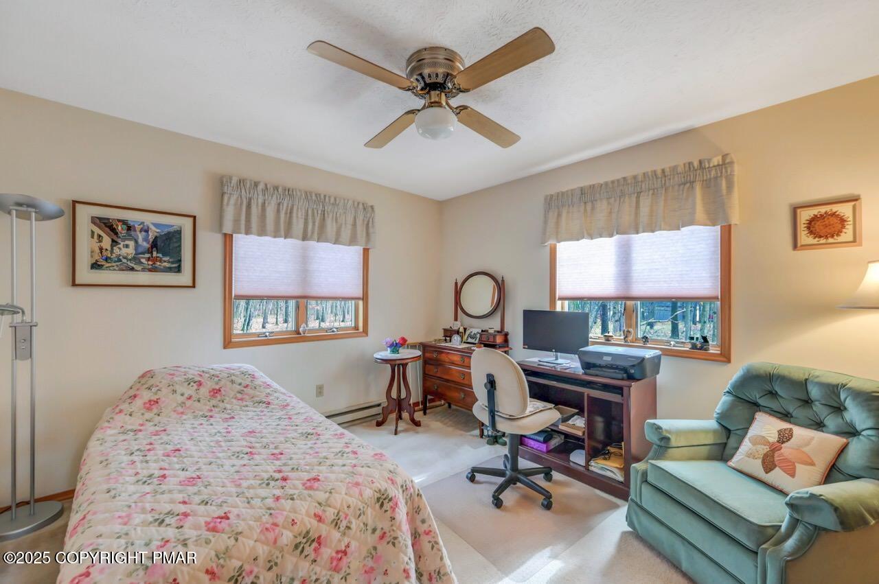 183 Panther Run Road Jim Thorpe, PA 18229 - Photo 33 of 59 a bedroom with a bed window and a table in it