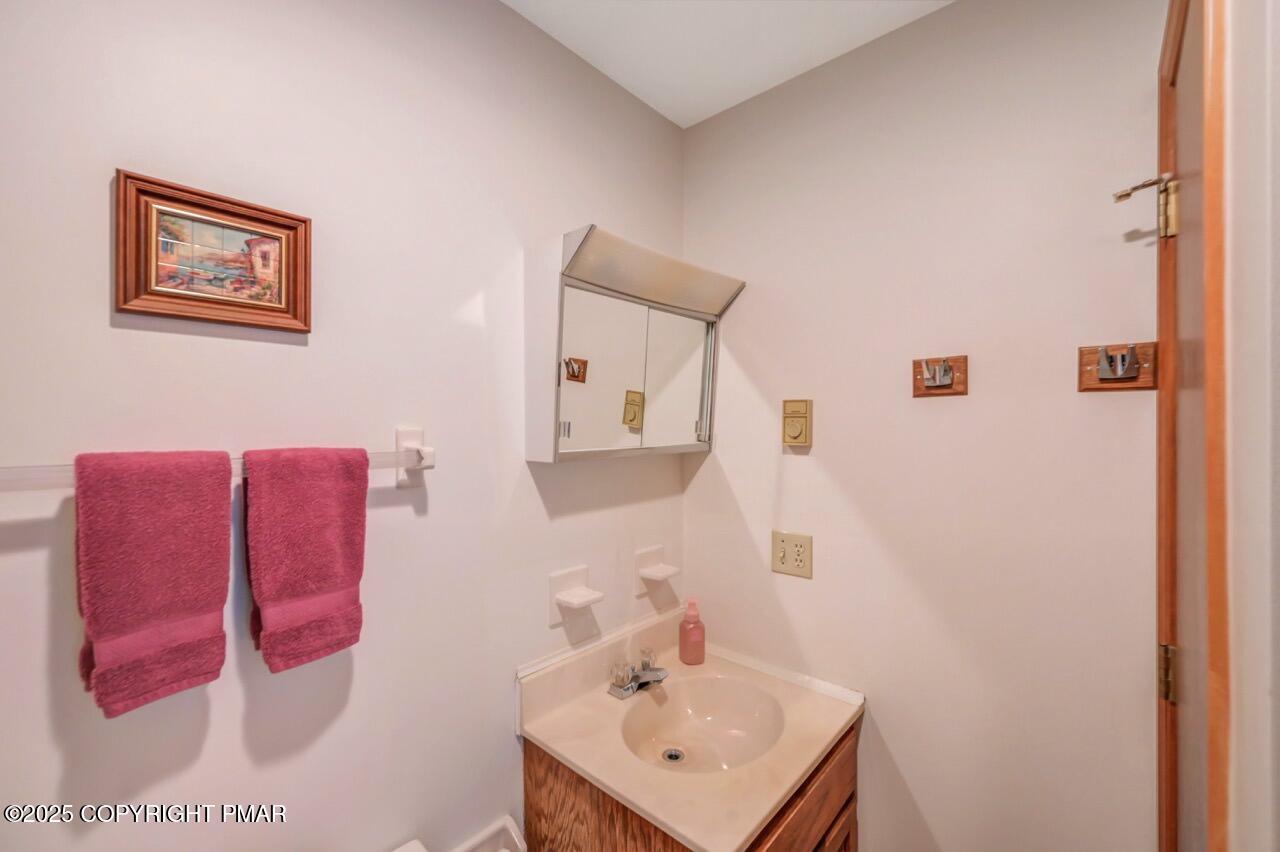 183 Panther Run Road Jim Thorpe, PA 18229 - Photo 44 of 59 a bathroom with a sink mirror and vanity