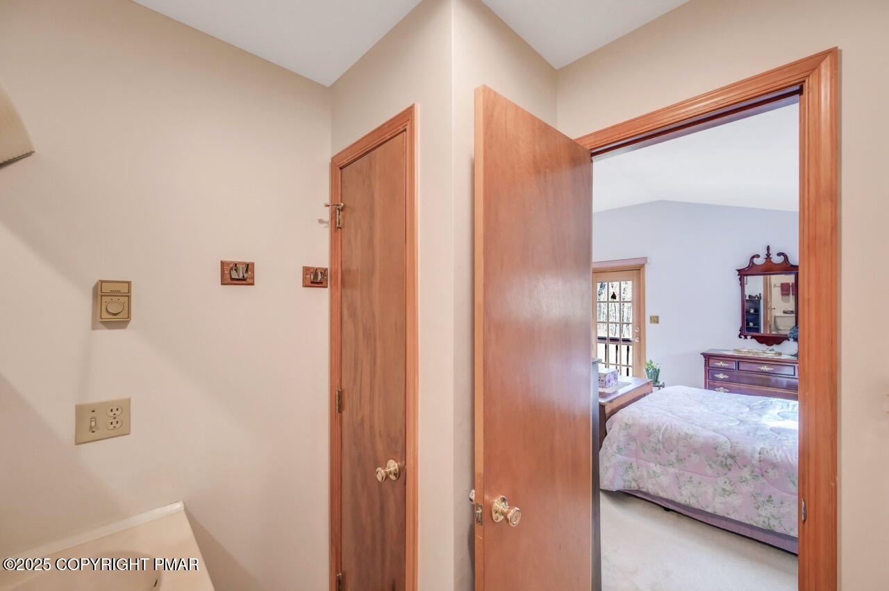 183 Panther Run Road Jim Thorpe, PA 18229 - Photo 45 of 59 a bedroom with a bed and a mirror