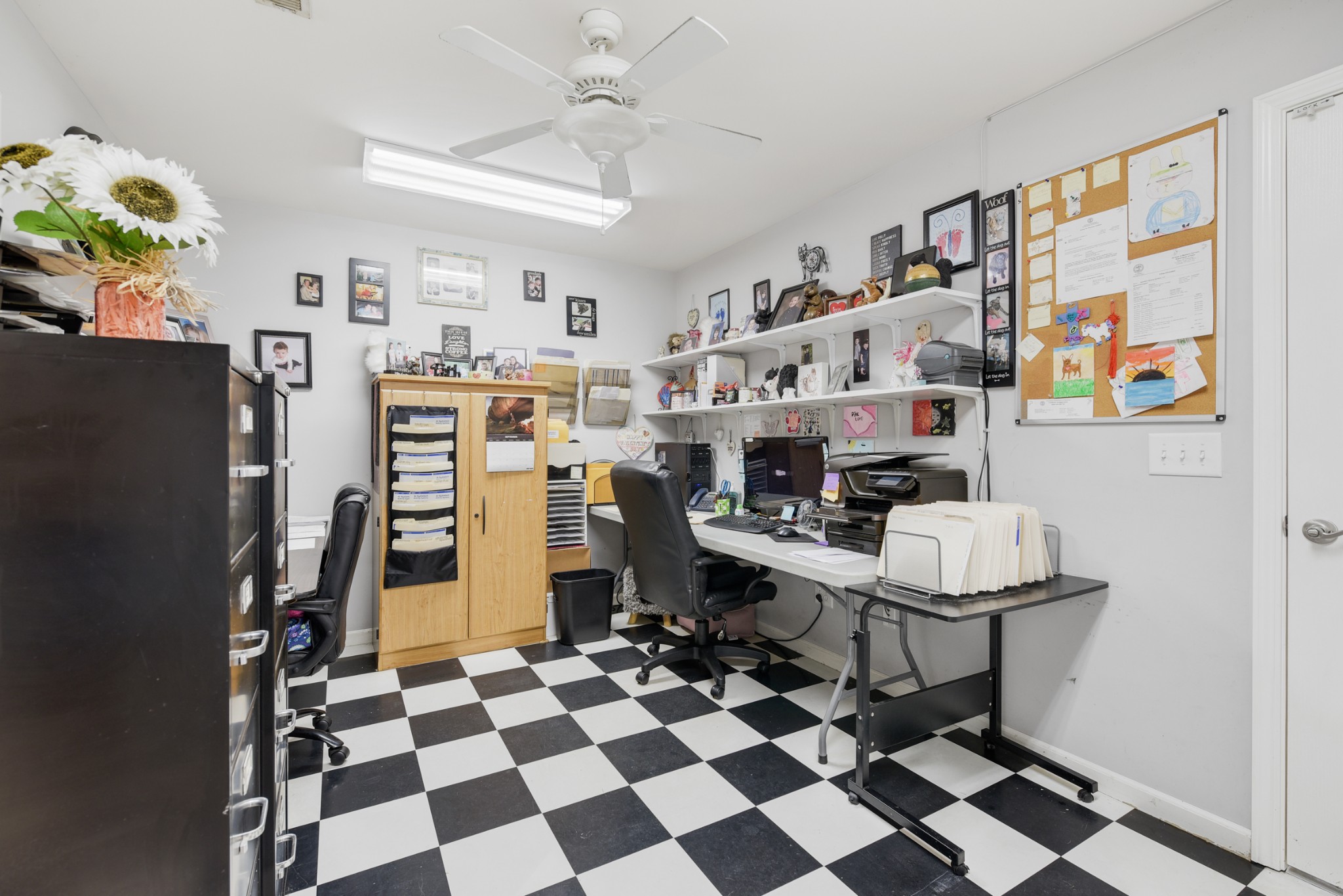 2650 McCrary Road Lebanon, TN 37090 - Photo 18 of 40 a room with a black white checkered floor with a rug and a window