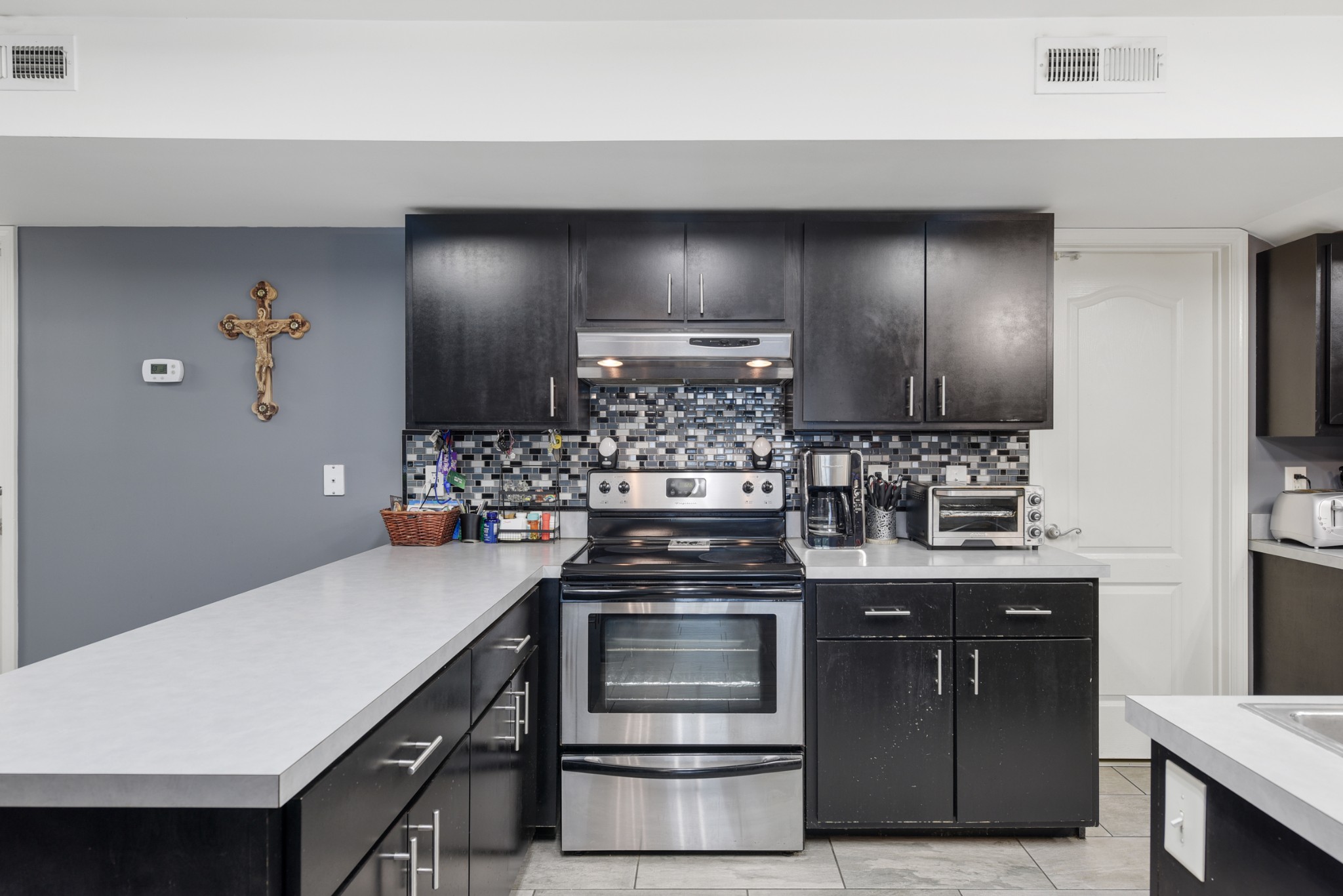 2650 McCrary Road Lebanon, TN 37090 - Photo 20 of 40 a kitchen with a stove and a cabinets