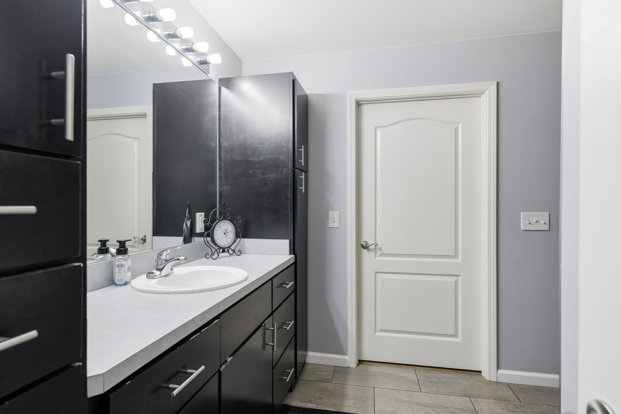 2650 McCrary Road Lebanon, TN 37090 - Photo 22 of 40 a bathroom with a sink vanity and a mirror