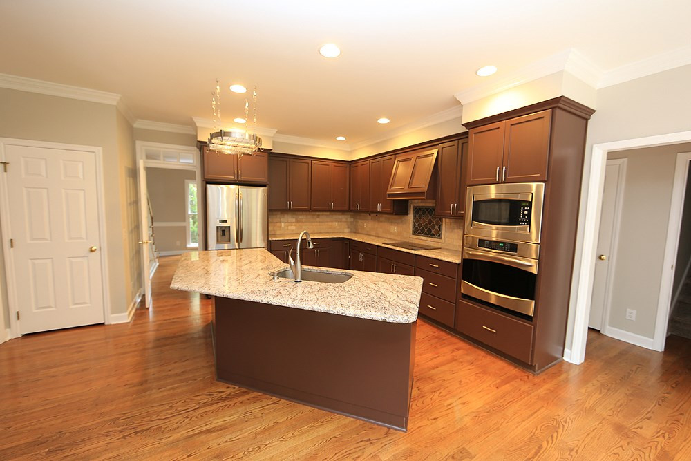 9001 Hemingwood Court Raleigh, NC 27613 - Photo 9 of 25 Open kitchen with stainless steel applainces, and granite counters. Kitchen