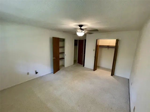 a view of an empty room with a cabinet