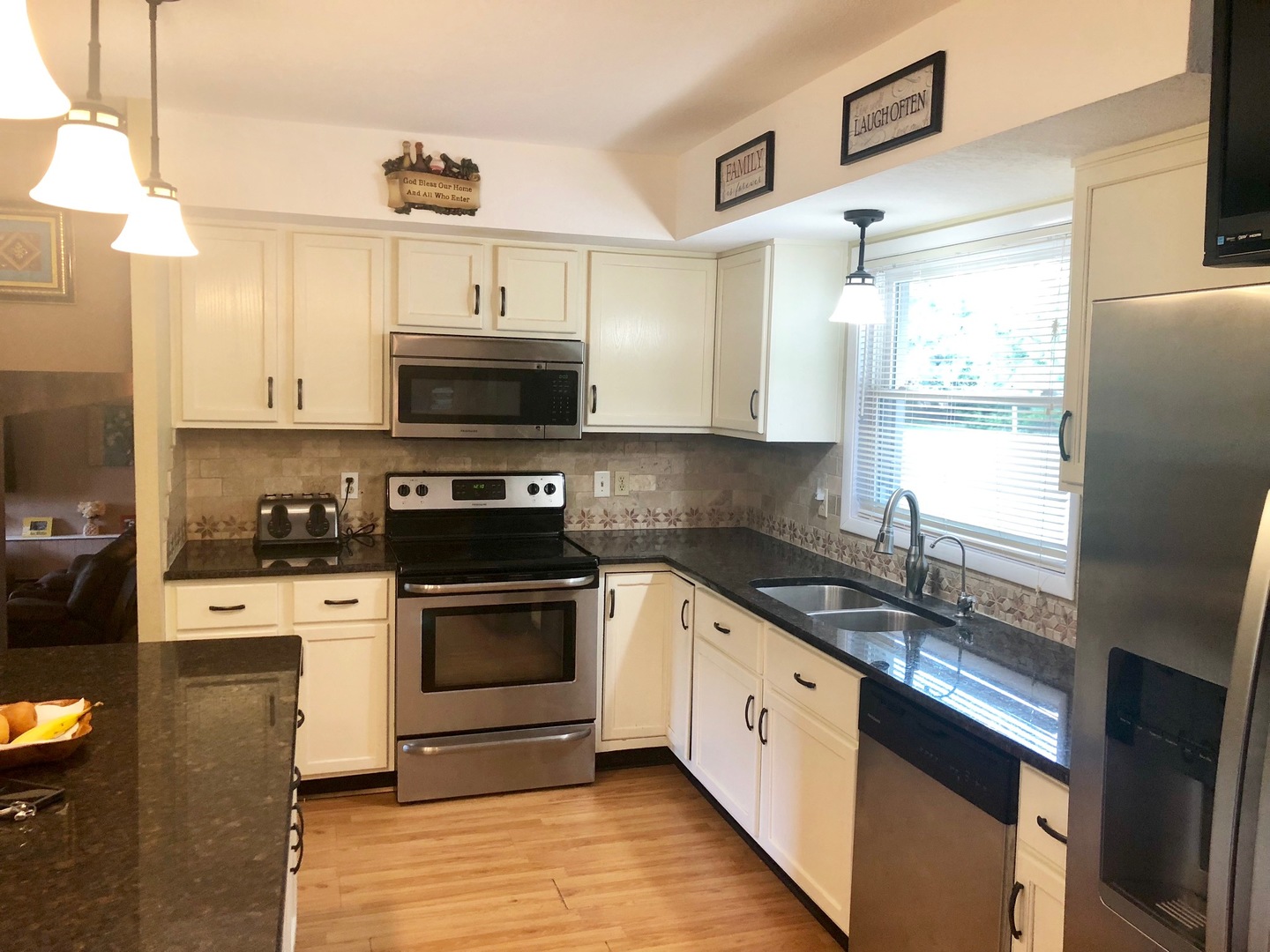 374 Rock Island Road Dixon, IL 61021 - Photo 2 of 20 a kitchen with stainless steel appliances granite countertop a stove a sink and a microwave