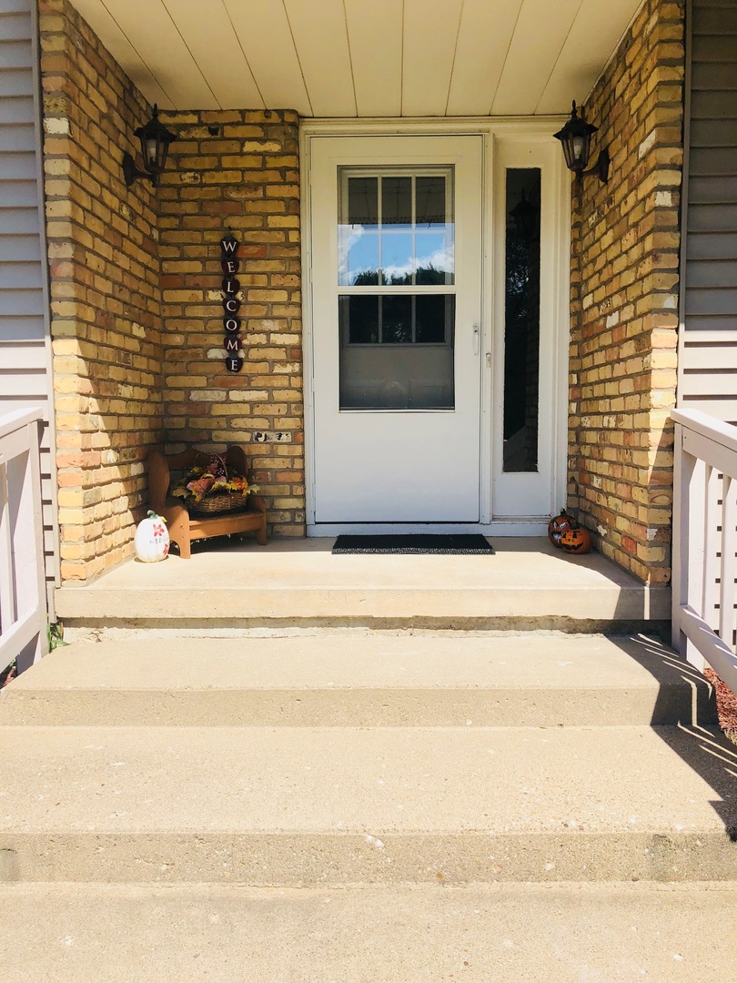 374 Rock Island Road Dixon, IL 61021 - Photo 17 of 20 a view of a brick house with a large windows
