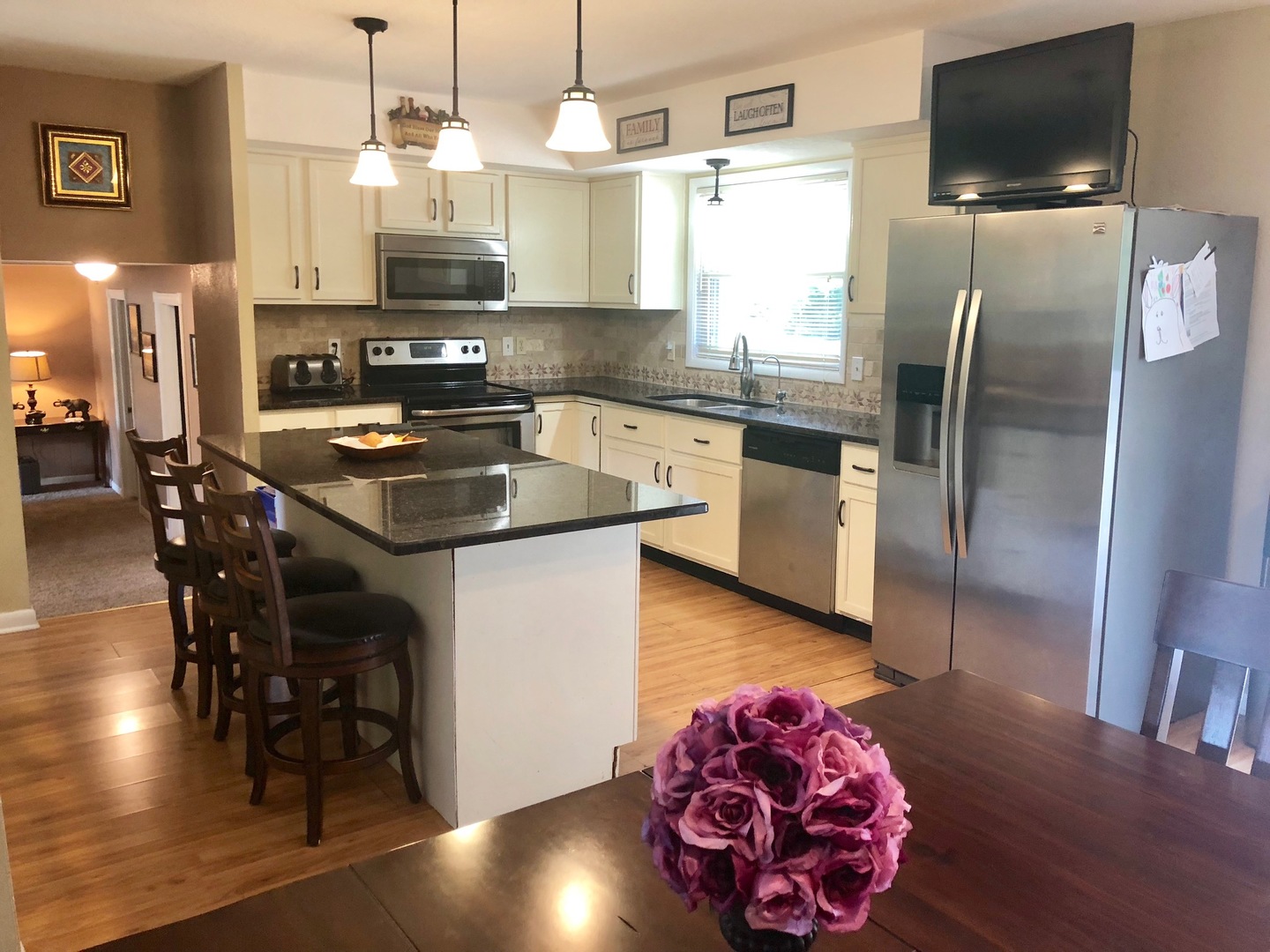 374 Rock Island Road Dixon, IL 61021 - Photo 4 of 20 a kitchen with stainless steel appliances granite countertop a sink refrigerator and microwave