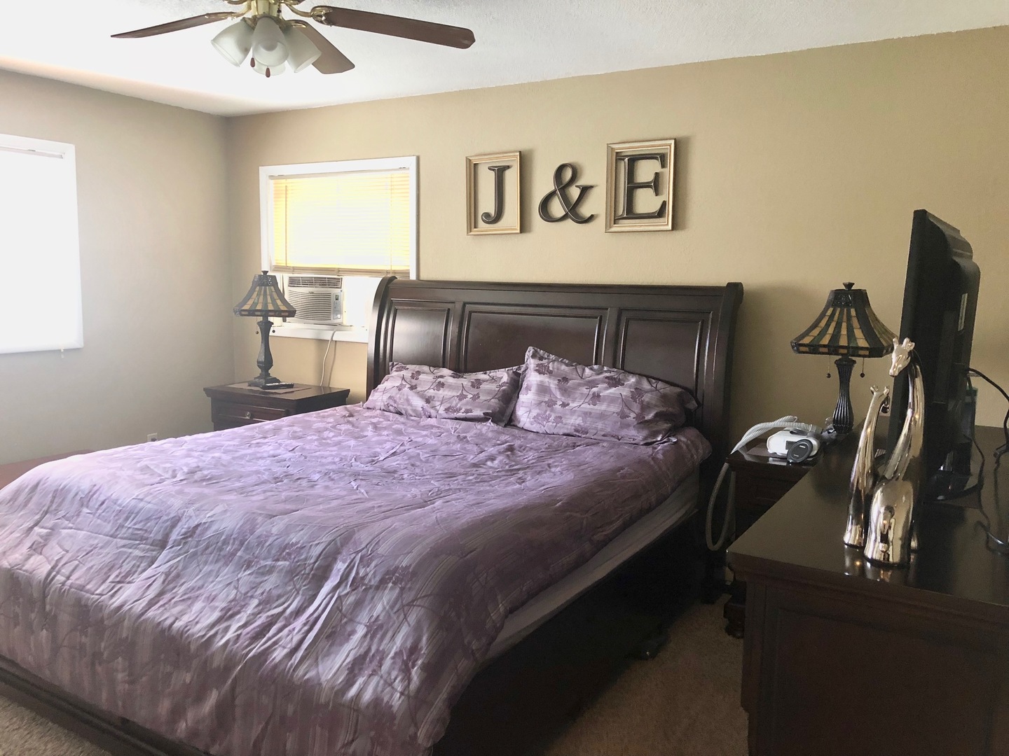 374 Rock Island Road Dixon, IL 61021 - Photo 9 of 20 a bedroom with a bed and a chandelier