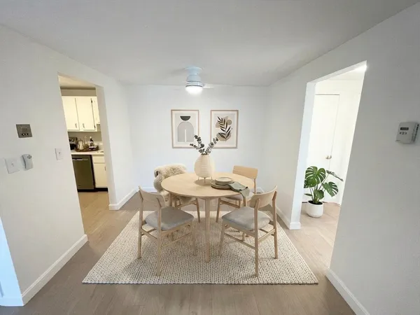 a dining room with furniture and window