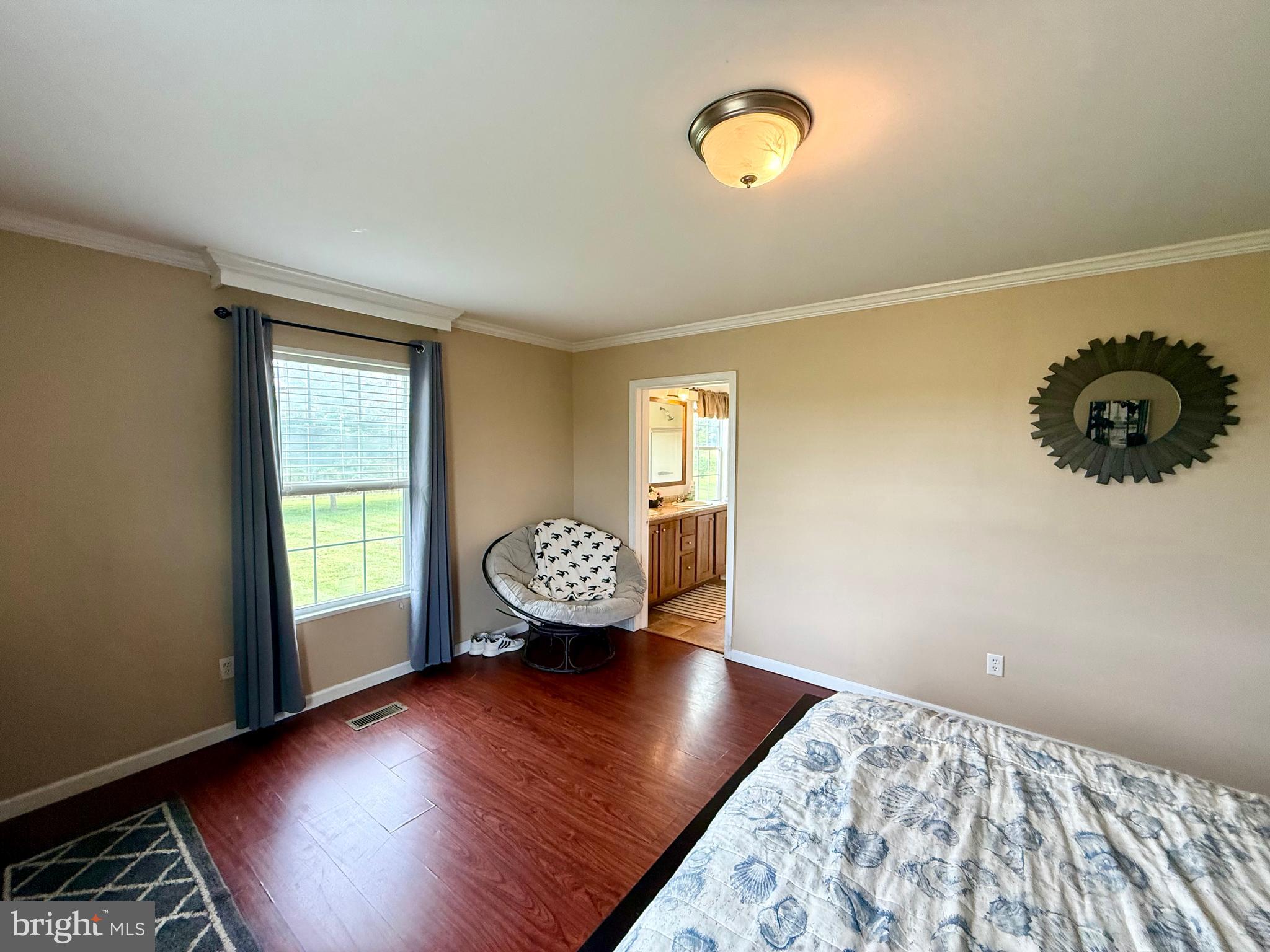 35777 Cobbs Hill Road Willards, MD 21874 - Photo 21 of 46 a view of an empty room with window and wooden floor