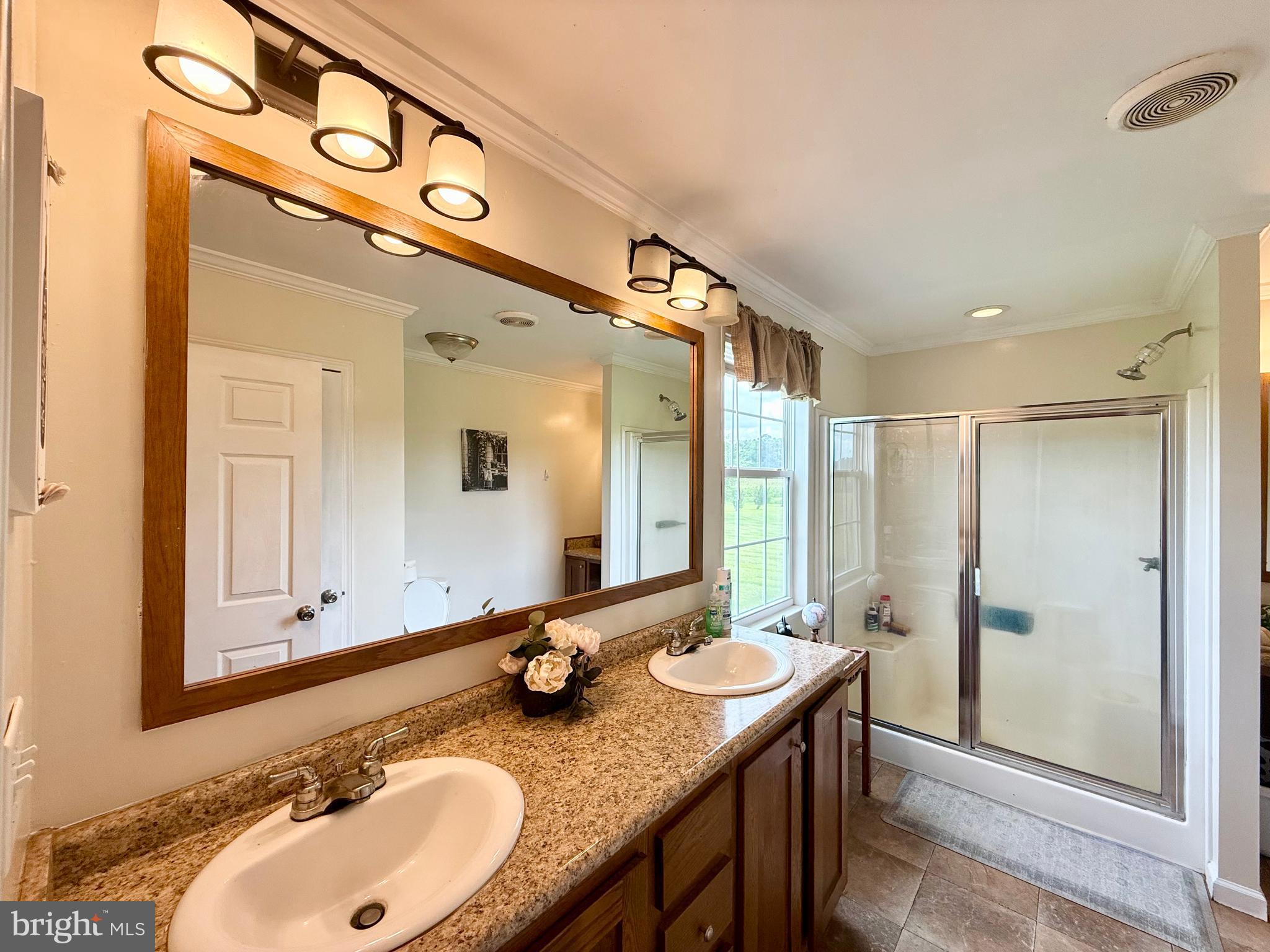 35777 Cobbs Hill Road Willards, MD 21874 - Photo 22 of 46 a bathroom with a sink and a mirror