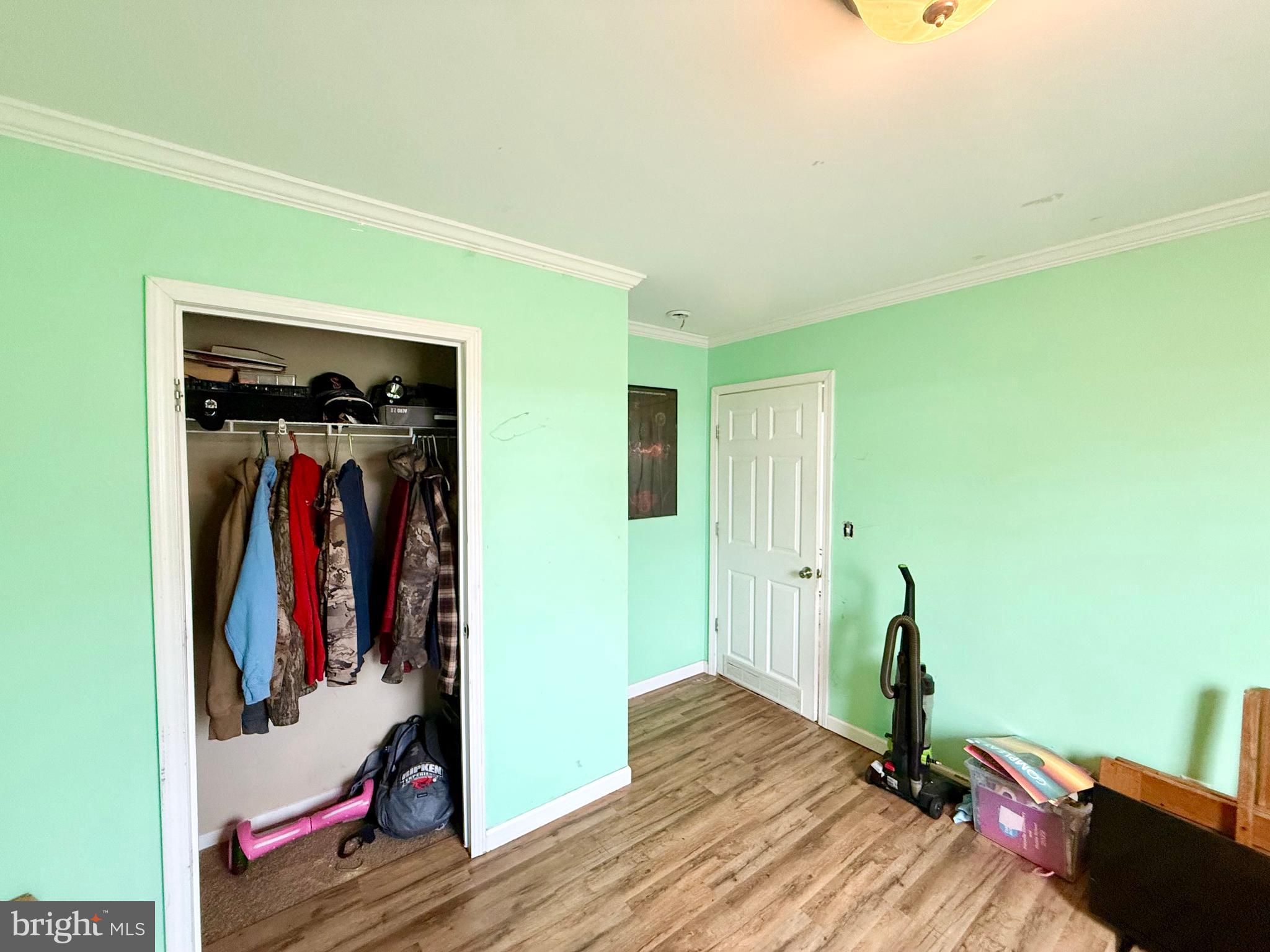 35777 Cobbs Hill Road Willards, MD 21874 - Photo 34 of 46 a view of a hallway with wooden floor and closet