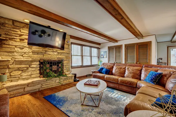 a living room with furniture and a fireplace