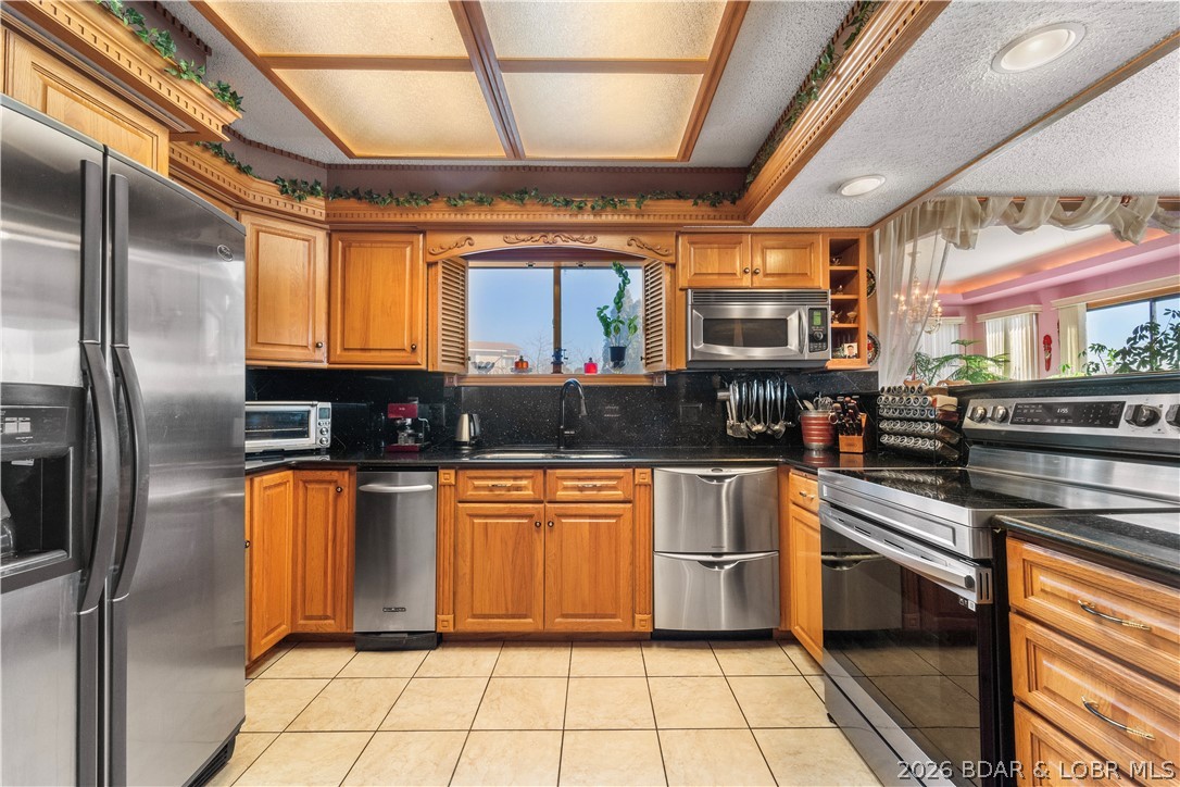 2264 Bittersweet Road Lake Ozark, MO 65049 - Photo 5 of 43 Stainless steel appliances and black granite