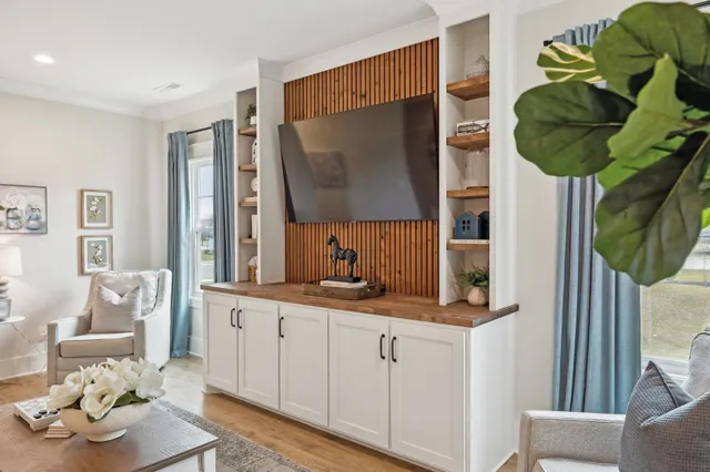 a living room with furniture and a flat screen tv
