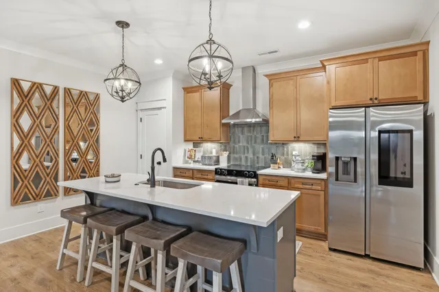 a kitchen with sink cabinets and stove