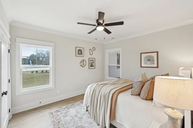 a view of a room that has a wooden table and chairs