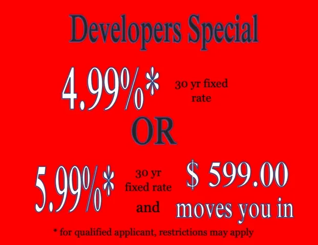 a kitchen with stainless steel appliances granite countertop a sink a stove and cabinets