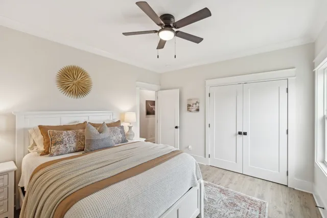 a bed room with a bed and a window