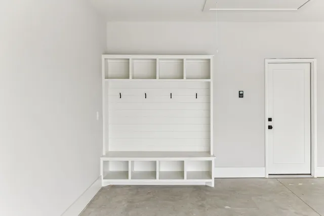 a view of a tennis court with a large trees