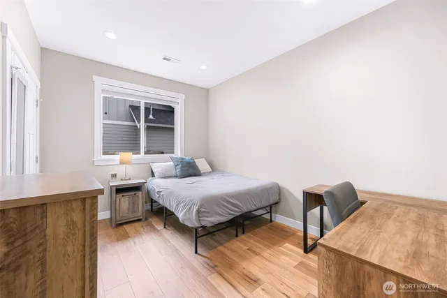 a bedroom with furniture and a window