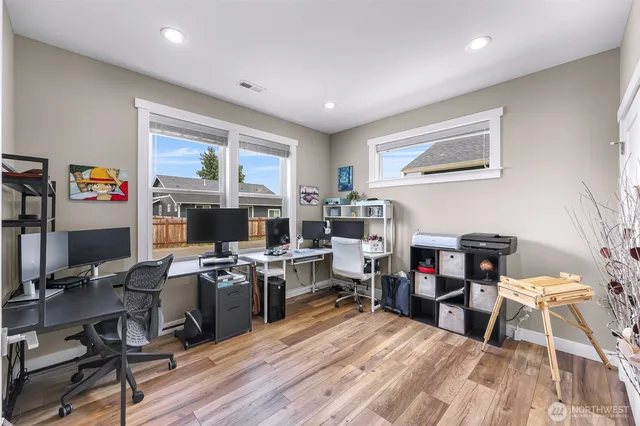 a view of a workspace with furniture and a workspace