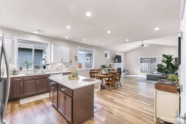 a large kitchen with lots of counter top space and living room