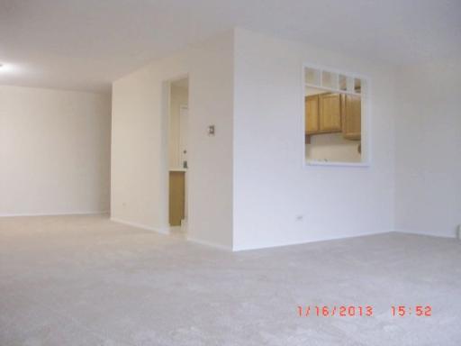 10353 Dearlove Road, Unit 5A Glenview, IL 60025 - Photo 4 of 9 an empty room with a hallway