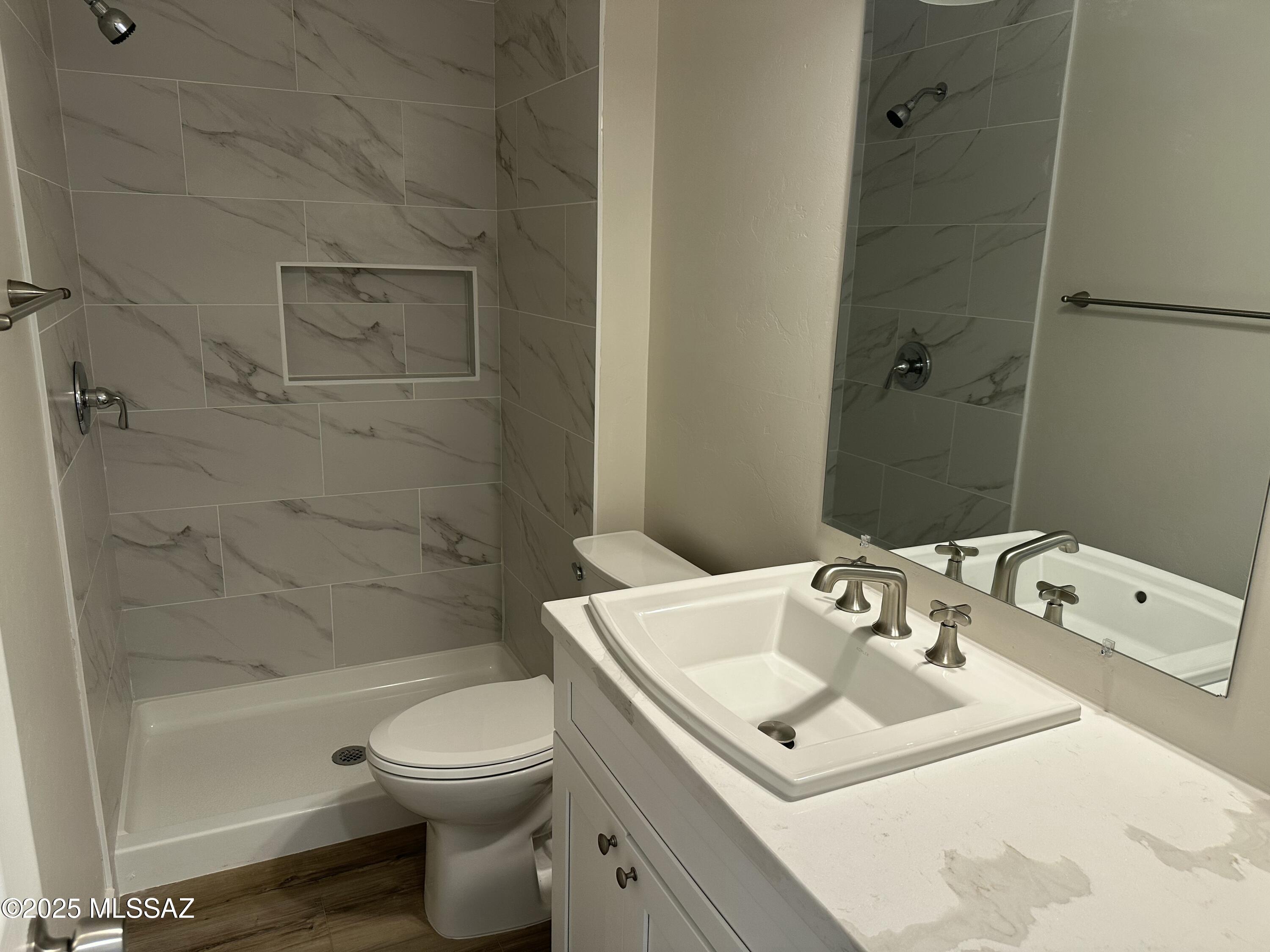 645 East Mabel Street Tucson, AZ 85705 - Photo 22 of 22 a bathroom with a sink a toilet and shower